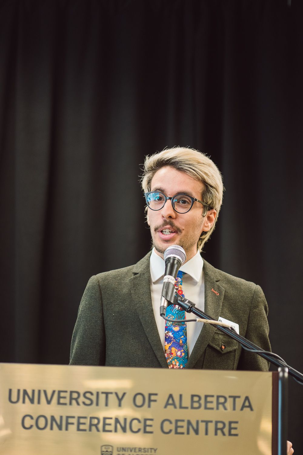 Hamid Hassani speaking at advocacy event